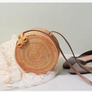 NWOT handwoven round rattan crossbody bag with a leather strap